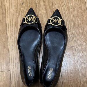Michael Kors Glossy Black Flats with Gold Emblem